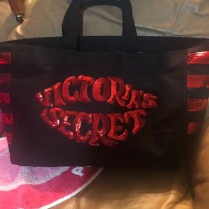 Victoria’s Secret bag is red and black.